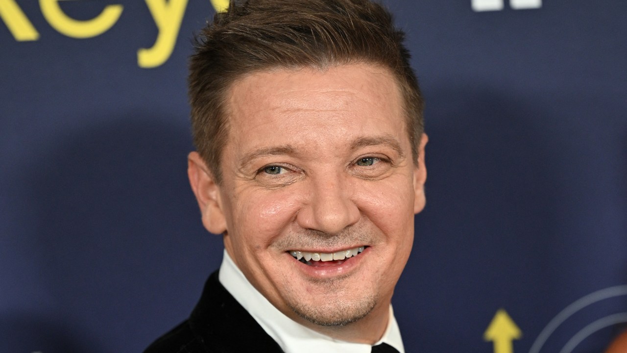 (FILES) In this file photo taken on November 17, 2021 US actor Jeremy Renner arrives for the premiere of Marvel Studios' television miniseries "Hawkeye" at the El Capitan Theatre in Los Angeles. - Movie star Jeremy Renner, known for his role as Hawkeye in several Marvel blockbusters, was in critical but stable condition following an accident while plowing snow, his representative told US media. Renner was using a truck-sized tracked snow vehicle about a quarter mile from his mountain home on January 1, 2023 when the vehicle accidentally ran over one of his legs, the TMZ tabloid news website said. (Photo by Robyn Beck / AFP)