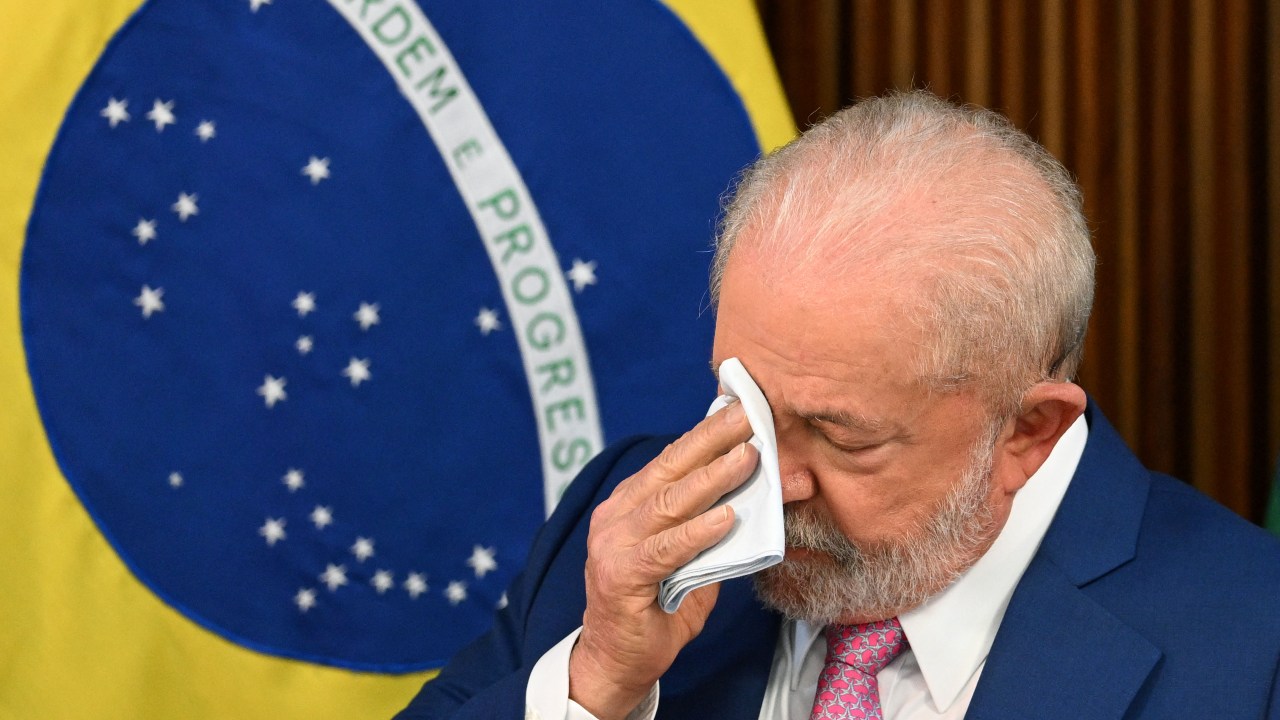 wipes his face during his government's first cabinet meeting at the Planalto Palace in Brasilia on January 6, 2023. (Photo by EVARISTO SA / AFP) / The erroneous mention[s] appearing in the metadata of this photo by EVARISTO SA has been modified in AFP systems in the following manner: [on January 6, 2023.] instead of [on December 6, 2023.]. Please immediately remove the erroneous mention[s] from all your online services and delete it (them) from your servers. If you have been authorized by AFP to distribute it (them) to third parties, please ensure that the same actions are carried out by them. Failure to promptly comply with these instructions will entail liability on your part for any continued or post notification usage. Therefore we thank you very much for all your attention and prompt action. We are sorry for the inconvenience this notification may cause and remain at your disposal for any further information you may require.