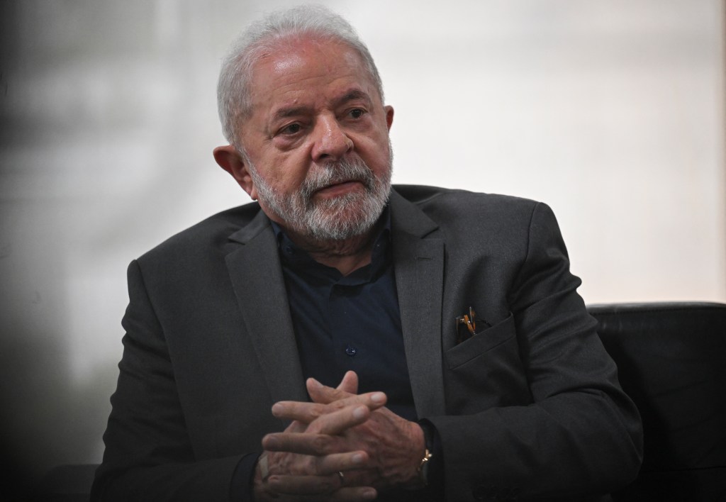 Brazil's President Luiz Inacio Lula Da Silva meets with Supreme Court ministers and his Cabinet at Planalto Presidential Palace in Brasilia on January 9, 2023. - Brazilian security forces locked down the area around Congress, the presidential palace and the Supreme Court Monday, a day after supporters of ex-president Jair Bolsonaro stormed the seat of power in riots that triggered an international outcry. In stunning scenes reminiscent of the January 6, 2021 invasion of the US Capitol building by supporters of then-president Donald Trump, backers of Bolsonaro broke through police cordons and overran the seats of power in Brasilia, smashing windows and doors and ransacking offices. (Photo by CARL DE SOUZA / AFP)