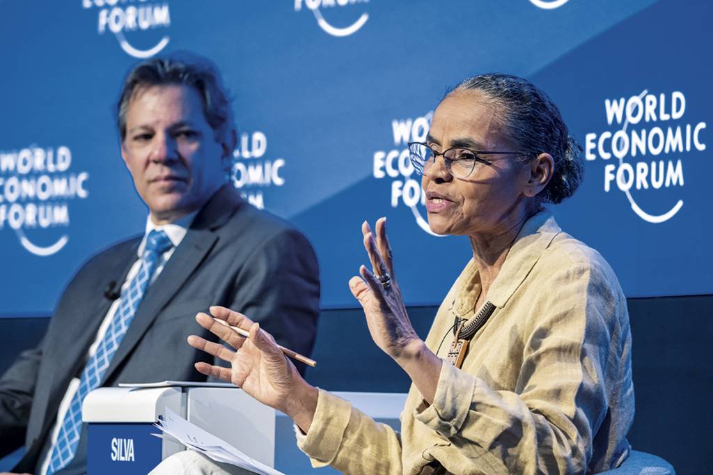 ESFORÇO - Haddad e Marina em Davos: tentativa de vender otimismo sobre o país -