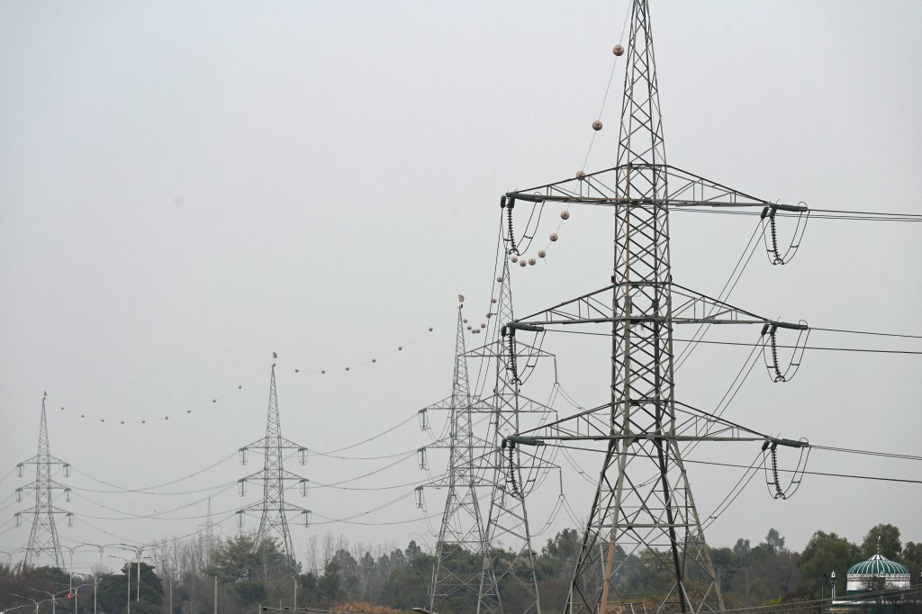 A general view of the high voltage lines during a nationwide power outage in Rawalpindi on January 23, 2023. - A massive power breakdown in Pakistan on January 23 affected most of the country's more than 220 million people, including in the mega cities of Karachi and Lahore. (Photo by Aamir QURESHI / AFP)