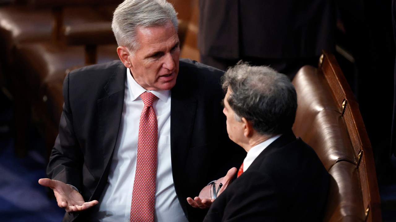 WASHINGTON, DC - JANUARY 05: U.S. House Republican Leader Kevin McCarthy (R-CA) (L) talks to Rep.-elect Andrew Clyde (R-GA) in the House Chamber during the third day of elections for Speaker of the House at the U.S. Capitol Building on January 05, 2023 in Washington, DC. The House of Representatives is meeting to vote for the next Speaker after House Republican Leader Kevin McCarthy (R-CA) failed to earn more than 218 votes on several ballots; the first time in 100 years that the Speaker was not elected on the first ballot. Anna Moneymaker/Getty Images/AFP (Photo by Anna Moneymaker / GETTY IMAGES NORTH AMERICA / Getty Images via AFP)