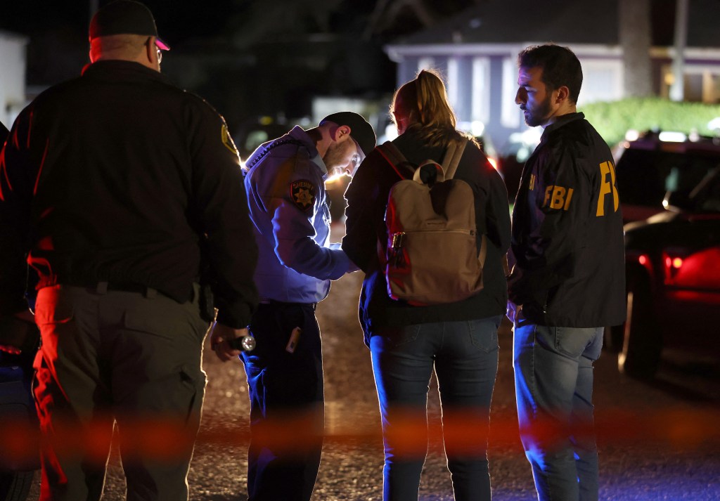 HALF MOON BAY, CALIFORNIA - JANUARY 23: A San Mateo County sheriff deputy checks in FBI agents as they arrive at the scene of a shooting on January 23, 2023 in Half Moon Bay, California. Seven people were killed at two separate farm locations that were only a few miles apart in Half Moon Bay on Monday afternoon. The suspect, Chunli Zhao, was taken into custody a few hours later without incident. Justin Sullivan/Getty Images/AFP (Photo by JUSTIN SULLIVAN / GETTY IMAGES NORTH AMERICA / Getty Images via AFP)