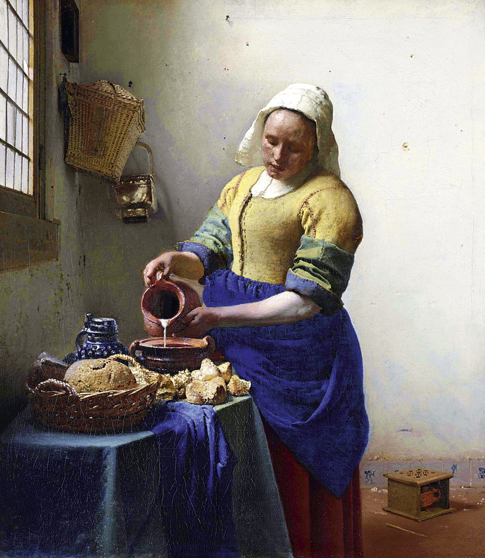 ABRE-A-Leiteira-_Johannes_Vermeer_-_De_melkmeid.jpg2 OBJETOS ESCONDIDOS - Em A Leiteira (ca. 1660), Vermeer pintou e depois apagou da cena um porta-jarro e um braseiro -