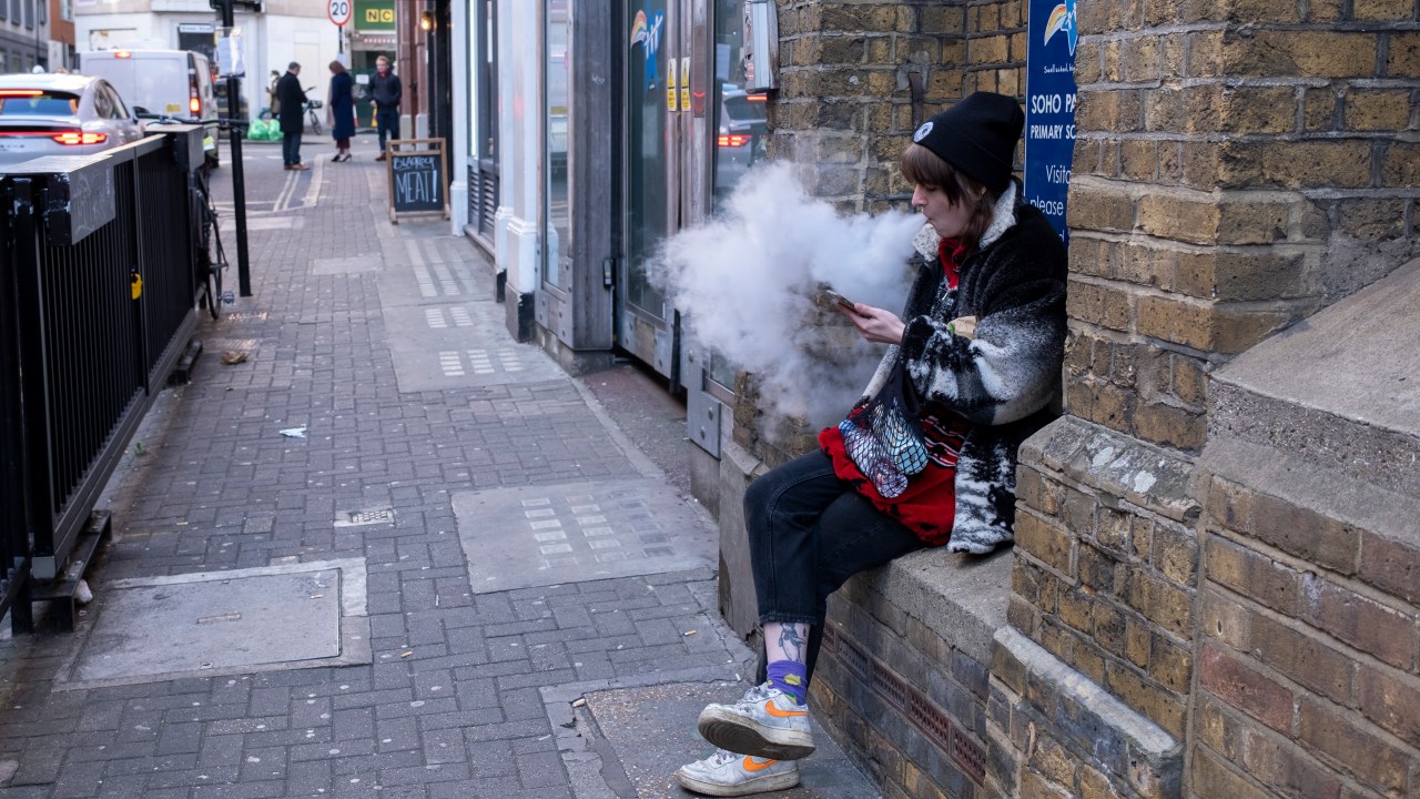 Young woman vaping thick clouds of smoke on the street in Soho on 6th December 2022 in London, United Kingdom. Vaping is often seen as a safe or safer alternative to smoking. It is also relatively new to the market, only hitting the mainstream over the past decade or so. (photo by Mike Kemp/In Pictures via Getty Images)