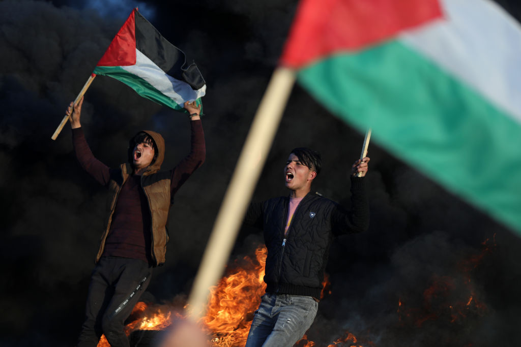 Palestinians react during clashes with Israeli forces, near the Israel-Gaza border east of Gaza City, January 26, 2023. (Photo by Majdi Fathi/NurPhoto via Getty Images)