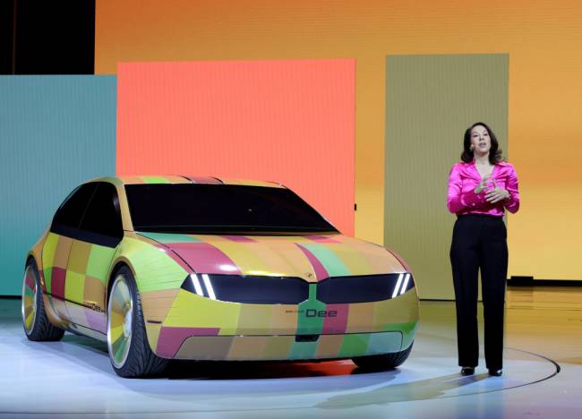 LAS VEGAS, NEVADA - JANUARY 04: BMW project manager Stella Clarke introduces the color-changing ability of the BMW i Vision Dee (Digital Emotional Experience) concept EV sport sedan during a keynote address by Chairman of the Board of Management of BMW AG Oliver Zipse at CES 2023 at The Pearl concert theater at Palms Casino Resort on January 04, 2023 in Las Vegas, Nevada. CES, the world's largest annual consumer technology trade show, runs from January 5-8 and features about 3,100 exhibitors showing off their latest products and services to more than 100,000 attendees. (Photo by Ethan Miller/Getty Images)