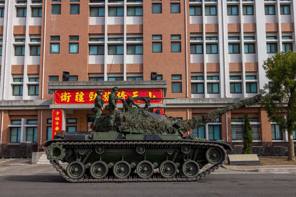 KAOHSIUNG, TAIWAN - JANUARY 11: Soldiers prepare the CM-11 Brave Tiger battle tank after the two-day routine drills to show combat readiness ahead of Lunar New Year holidays at a military base on January 11, 2023 in Kaohsiung, Taiwan. The self-ruled island of Taiwan continues to hold defensive drills, as tensions remain high in the Taiwan straits. (Photo by Annabelle Chih/Getty Images)