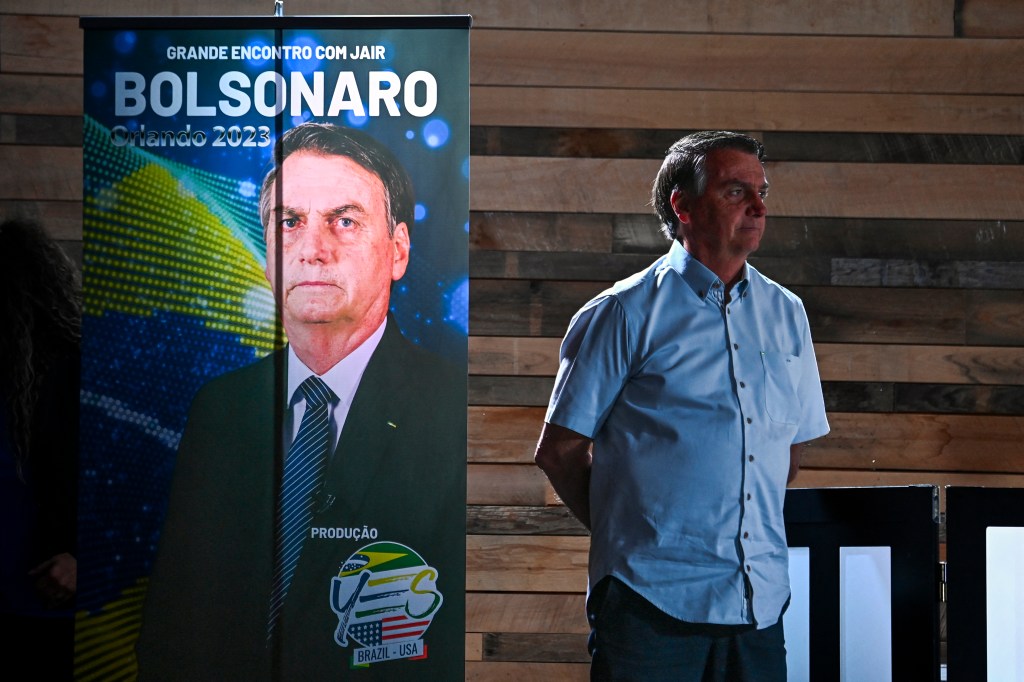 Former President of Brazil Jair Bolsonaro looks on during a news conference at Dezerland Park in Orlando, Florida, on January 31, 2023. (Photo by CHANDAN KHANNA / AFP)