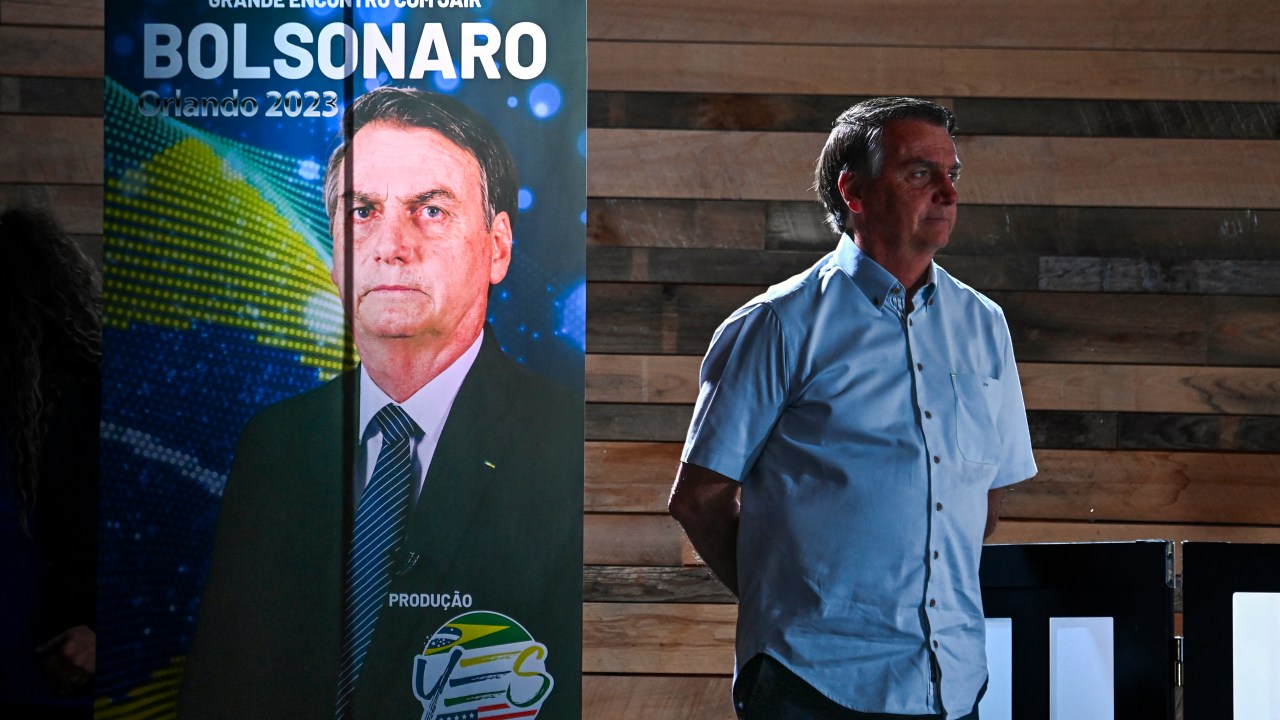 Former President of Brazil Jair Bolsonaro looks on during a news conference at Dezerland Park in Orlando, Florida, on January 31, 2023. (Photo by CHANDAN KHANNA / AFP)