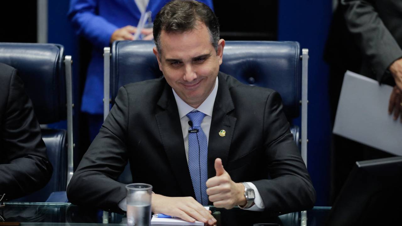 President of Brazil's Federal Senate, Rodrigo Pacheco, gestures during the swearing-in ceremony of the new Brazilian senate at the Federal Senate plenary in Brasilia on February 1, 2023. (Photo by Sergio Lima / AFP)