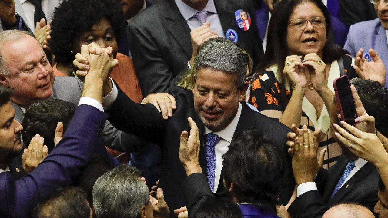 Brazilian deputy Arthur Lira greets deputies after being re-elected as President of the Chamber of Deputies at the National Congress in Brasilia, on February 1, 2023. (Photo by Sergio Lima / AFP)