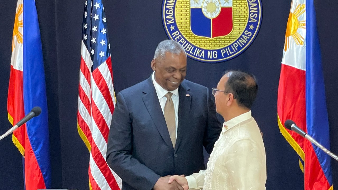 US Defense Secretary Lloyd Austin III (L) shakes hands with his Philippine counterpart Carlito Galvez Jr. at a joint press conference in Camp Aguinaldo military headquarters in metro Manila on February 2, 2023. (Photo by Joeal Calupitan / POOL / AFP)
