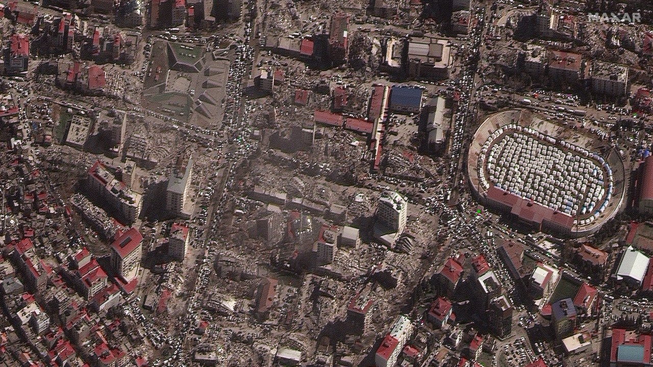 This handout satellite image courtesy of Maxar Technologies shows destroyed buildings and emergency shelters in a stadium in Kahramanmaras, Turkey on February 8, 2023, after an 7.8 magnitude earthquake which struck the region on February 6, 2023. - The death toll from a massive earthquake that struck Turkey and Syria climbed above 12,000 on February 8, 2023, as rescuers raced to save survivors trapped under debris in freezing weather. Officials and medics said 9,057 people had died in Turkey and 2,992 in Syria from Monday's 7.8-magnitude tremor, bringing the total to 12,049. (Photo by Satellite image ©2023 Maxar Technologies / AFP) / RESTRICTED TO EDITORIAL USE - MANDATORY CREDIT "AFP PHOTO / Satellite image ©2023 Maxar Technologies" - NO MARKETING NO ADVERTISING CAMPAIGNS - DISTRIBUTED AS A SERVICE TO CLIENTS