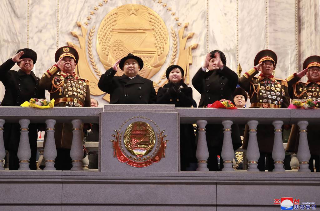 This picture taken on February 8, 2023 and released from North Korea's official Korean Central News Agency (KCNA) on February 9, 2023 shows North Korea's leader Kim Jong Un (C) saluting as his daughter presumed to be named Ju Ae (centre R) looks on, during a military parade celebrating the 75th anniversary of the founding of the Korean People's Army in Kim Il Sung Square in Pyongyang. (Photo by KCNA VIA KNS / AFP) / South Korea OUT / ---EDITORS NOTE--- RESTRICTED TO EDITORIAL USE - MANDATORY CREDIT 