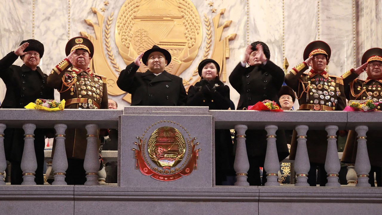 This picture taken on February 8, 2023 and released from North Korea's official Korean Central News Agency (KCNA) on February 9, 2023 shows North Korea's leader Kim Jong Un (C) saluting as his daughter presumed to be named Ju Ae (centre R) looks on, during a military parade celebrating the 75th anniversary of the founding of the Korean People's Army in Kim Il Sung Square in Pyongyang. (Photo by KCNA VIA KNS / AFP) / South Korea OUT / ---EDITORS NOTE--- RESTRICTED TO EDITORIAL USE - MANDATORY CREDIT "AFP PHOTO/KCNA VIA KNS" - NO MARKETING NO ADVERTISING CAMPAIGNS - DISTRIBUTED AS A SERVICE TO CLIENTS / THIS PICTURE WAS MADE AVAILABLE BY A THIRD PARTY. AFP CAN NOT INDEPENDENTLY VERIFY THE AUTHENTICITY, LOCATION, DATE AND CONTENT OF THIS IMAGE --- /