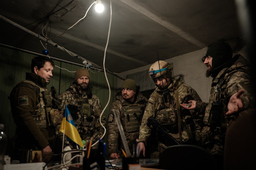 Ukrainian servicemen of the State Border Guard Service work in the operations room in Bakhmut on February 9, 2023, amid the Russian invasion of Ukraine. (Photo by YASUYOSHI CHIBA / AFP)