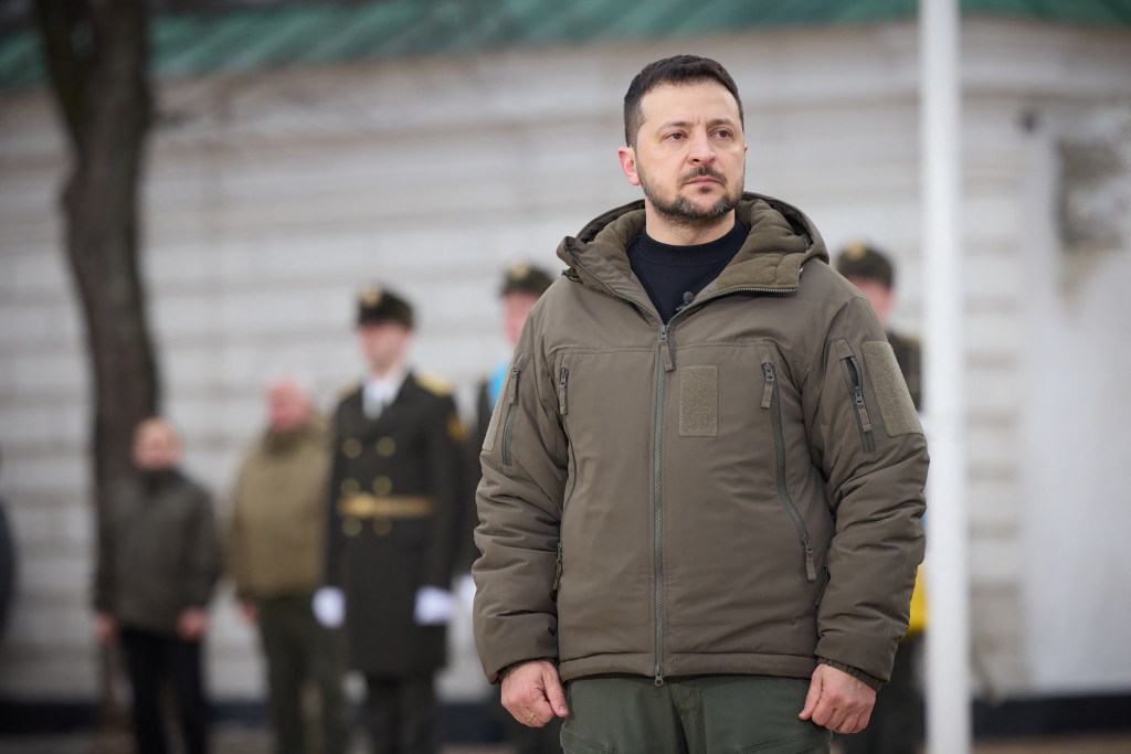 This handout picture taken and released by Ukrainian Presidential press service on February 24, 2023, shows the Ukrainian President Volodymyr Zelensky standing during a ceremony at St Sophia Square in Kyiv, on the first anniversary of the Russian invasion of Ukraine. (Photo by Handout / UKRAINIAN PRESIDENTIAL PRESS SERVICE / AFP) / RESTRICTED TO EDITORIAL USE - MANDATORY CREDIT "AFP PHOTO / Ukrainian Presidential press service" - NO MARKETING NO ADVERTISING CAMPAIGNS - DISTRIBUTED AS A SERVICE TO CLIENTS