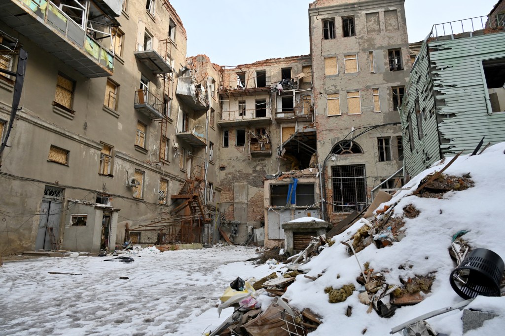 This photograph shows a residential building destroyed as a result of Russian shelling in Kharkiv on February 24, 2023, on the first anniversary of the Russian invasion of Ukraine. (Photo by SERGEY BOBOK / AFP)