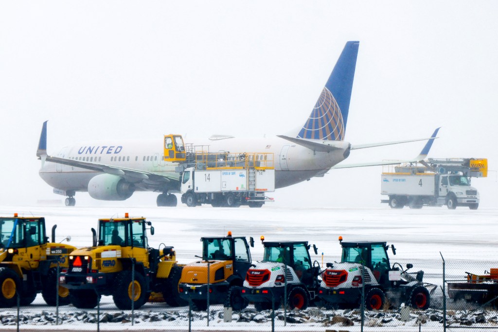 DENVER, CO - FEBRUARY 22: A United Airlines flight is de-iced before takeoff during a winter storm at Denver International Airport on February 22, 2023 in Denver, Colorado. More than 1000 flights have been canceled across the U.S. as the storm impacts travel around the country. Michael Ciaglo/Getty Images/AFP (Photo by Michael Ciaglo / GETTY IMAGES NORTH AMERICA / Getty Images via AFP)