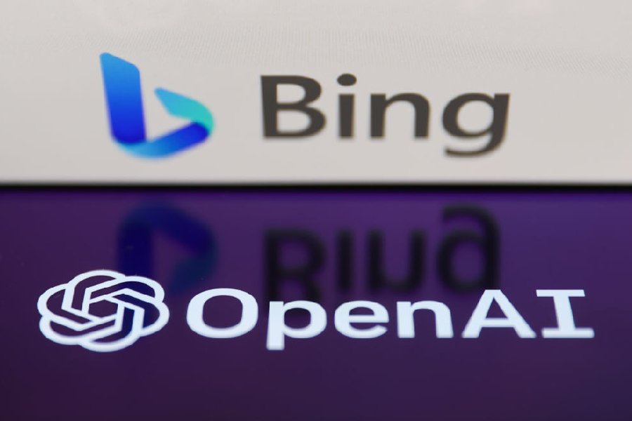 Bing logo displayed on a laptop screen and OpenAI logo displayed on a phone screen are seen in this illustration photo taken in Krakow, Poland on February 7, 2023