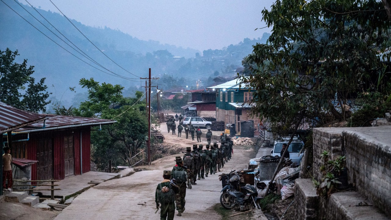 In this photo taken on March 9, 2023 members of ethnic rebel group Ta'ang National Liberation Army (TNLA) patrol near Namhsan Township in Myanmar's northern Shan State. (Photo by AFP)