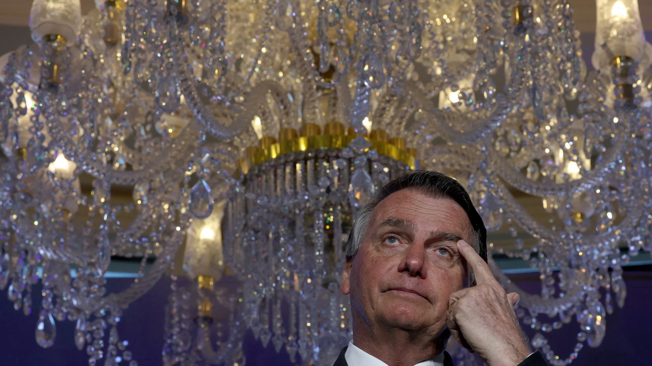 (FILES) In this file photo taken on February 3, 2023, far-right former Brazilian President Jair Bolsonaro speaks during the Turning Point USA event at the Trump National Doral Miami resort in Doral, Florida. - Lawyers for Jair Bolsonaro say the former Brazilian president has agreed to hand over to authorities jewels gifted by Saudi Arabia and which entered the country without being declared to tax authorities, local media reported on March 13, 2023. (Photo by JOE RAEDLE / GETTY IMAGES NORTH AMERICA / AFP)
