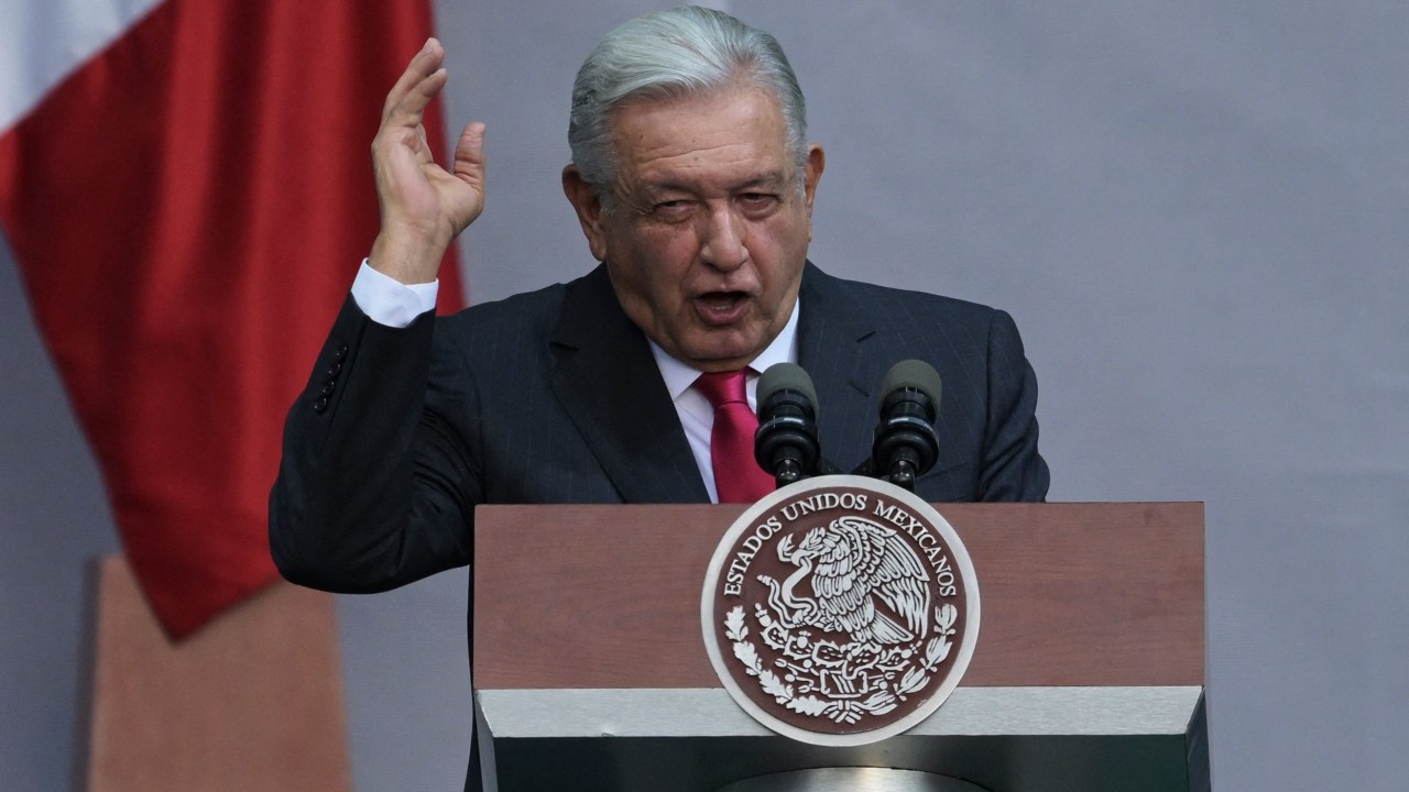 Mexican President Andres Manuel Lopez Obrador delivers a speech after a demonstration following the president's call for the 85th anniversary of the nationalization of oil in the middle of a controversy on electoral reform at the Zocalo square in Mexico City on March 18, 2023. (Photo by RODRIGO ARANGUA / AFP)