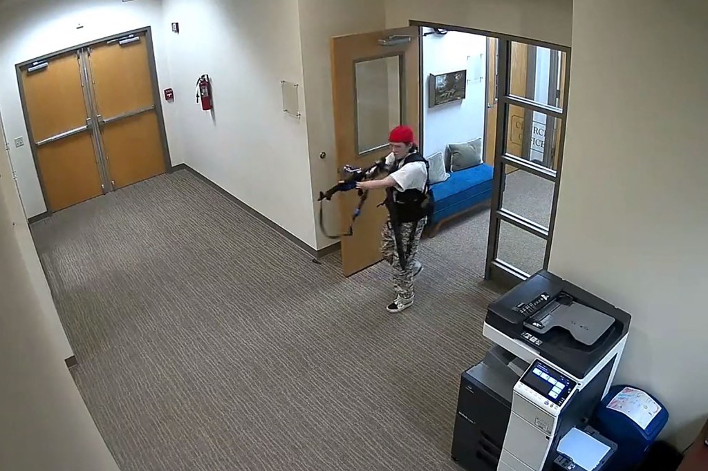 This handout video grab image courtesy of the Metropolitan Nashville Police Department released on March 27, 2023, shows suspect Audrey Hale holding an assault rifle at the Covenant School building at the Covenant Presbyterian Church, in Nashville, Tennessee. - A heavily armed former student killed three young children and three staff in what appeared to be a carefully planned attack at a private elementary school in Nashville on Monday, before being shot dead by police. Chief of Police John Drake named the suspect as Audrey Hale, 28, who the officer later said identified as transgender. (Photo by Metropolitan Nashville Police Department / AFP) / RESTRICTED TO EDITORIAL USE - MANDATORY CREDIT "AFP PHOTO / Metropolitan Nashville Police Department " - NO MARKETING - NO ADVERTISING CAMPAIGNS - DISTRIBUTED AS A SERVICE TO CLIENTS