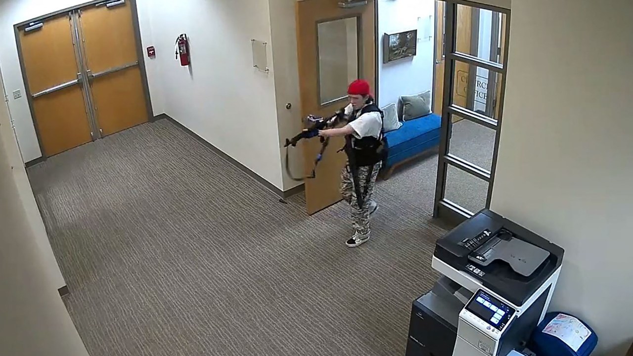 This handout video grab image courtesy of the Metropolitan Nashville Police Department released on March 27, 2023, shows suspect Audrey Hale holding an assault rifle at the Covenant School building at the Covenant Presbyterian Church, in Nashville, Tennessee. - A heavily armed former student killed three young children and three staff in what appeared to be a carefully planned attack at a private elementary school in Nashville on Monday, before being shot dead by police. Chief of Police John Drake named the suspect as Audrey Hale, 28, who the officer later said identified as transgender. (Photo by Metropolitan Nashville Police Department / AFP) / RESTRICTED TO EDITORIAL USE - MANDATORY CREDIT "AFP PHOTO / Metropolitan Nashville Police Department " - NO MARKETING - NO ADVERTISING CAMPAIGNS - DISTRIBUTED AS A SERVICE TO CLIENTS