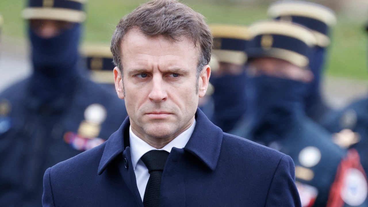 French President Emmanuel Macron attends a ceremony in tribute to French GIGN gendarme Marechal des Logis-Chef Arnaud Blanc, who was killed in an operation against illegal gold mining in French Guiana, at the French National Gendarmerie Intervention Group (GIGN) base of Versailles-Satory in Versailles, west of Paris, on March 31, 2023. - The 35-year-old elite gendarmerie sub-officer was killed in the French overseas territory in South America on March 25, 2023, after being shot by an armed group during the operation. (Photo by Ludovic MARIN / POOL / AFP)