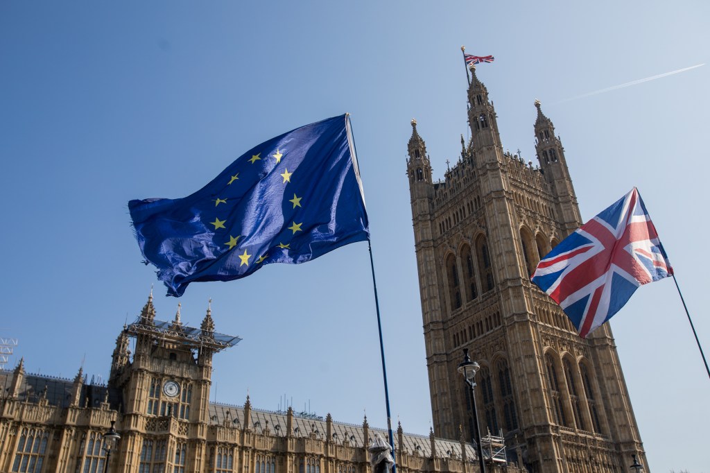 A European Union (EU) flies alongside a British Union flag, also known as a Union Jack in London. Photographer: Jason Alden/Bloomberg