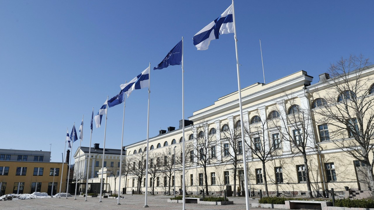 Finnish and Nato flags flutter at the courtyard of the Foreign Ministry in Helsinki, Finland, ahead of accession to the North Atlantic Treaty Organization (NATO) on April 4, 2023. - Finland becomes the 31st member of NATO, in a historic strategic shift provoked by Moscow's war on Ukraine, which doubles the US-led alliance's border with Russia. (Photo by Antti Hämäläinen / Lehtikuva / AFP) / Finland OUT