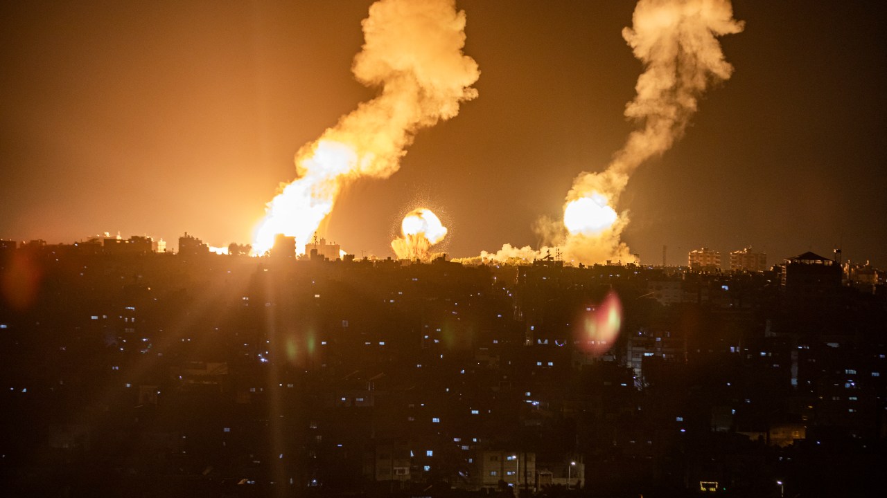 This picture taken early on April 7, 2023 shows explosions in Khan Yunis in the southern Gaza Strip during Israeli air strikes on the Palestinian enclave. (Photo by AFP)