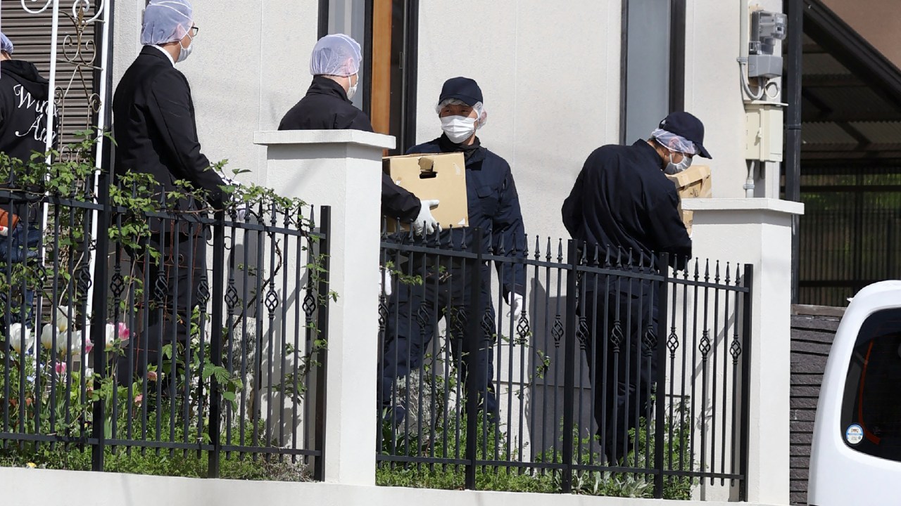 Police investigators carry cardboard boxes out after conducting a search at the home of a man, whom local media have named as 24-year-old Ryuji Kimura, who is believed to have thrown an explosive toward Japan's Prime Minister Fumio Kishida, in Kawanishi, Hyogo prefecture, on April 16, 2023. - Kimura was arrested after a device, reportedly a pipe bomb, was thrown towards Kishida as he campaigned in the western city of Wakayama on April 15. Local media reports said Kimura, who was arrested on suspicion of obstruction of business, has so far refused to speak to investigators. (Photo by JIJI Press / AFP) / Japan OUT