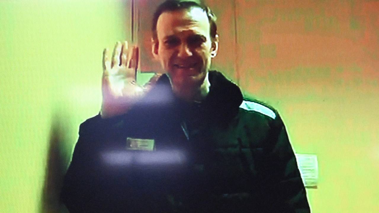 Jailed Russian opposition figure Alexei Navalny is seen on a screen via a video link from his penal colony before a hearing over the extremism criminal case against him, at the Basmanny district court in Moscow on April 26, 2023. (Photo by Kirill KUDRYAVTSEV / AFP)