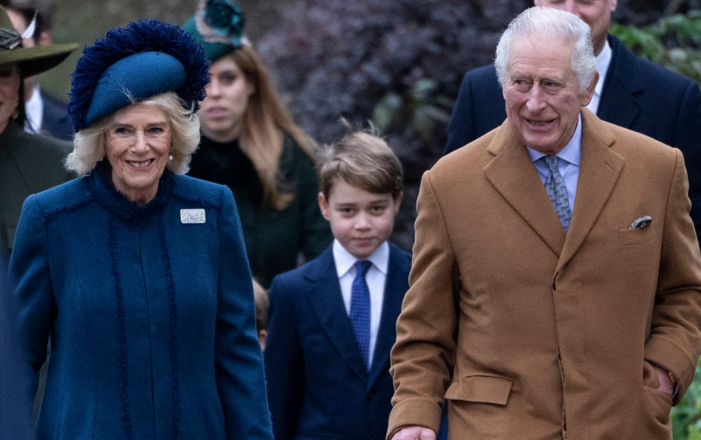 SANDRINGHAM, NORFOLK - DECEMBER 25: King Charles III, Camilla, Queen Consort and Prince George of Wales (C) attend the Christmas Day service at St Mary Magdalene Church on December 25, 2022 in Sandringham, Norfolk. King Charles III ascended to the throne on September 8, 2022, with his coronation set for May 6, 2023. (Photo by Mark Cuthbert/UK Press via Getty Images)