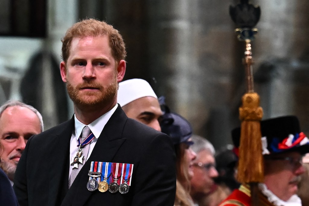 Britain's Prince Harry, Duke of Sussex looks on as Britain's King Charles III leaves Westminster Abbey after the Coronation Ceremonies in central London on May 6, 2023. The set-piece coronation is the first in Britain in 70 years, and only the second in history to be televised. Charles will be the 40th reigning monarch to be crowned at the central London church since King William I in 1066. Outside the UK, he is also king of 14 other Commonwealth countries, including Australia, Canada and New Zealand. (Photo by Ben Stansall / POOL / AFP)