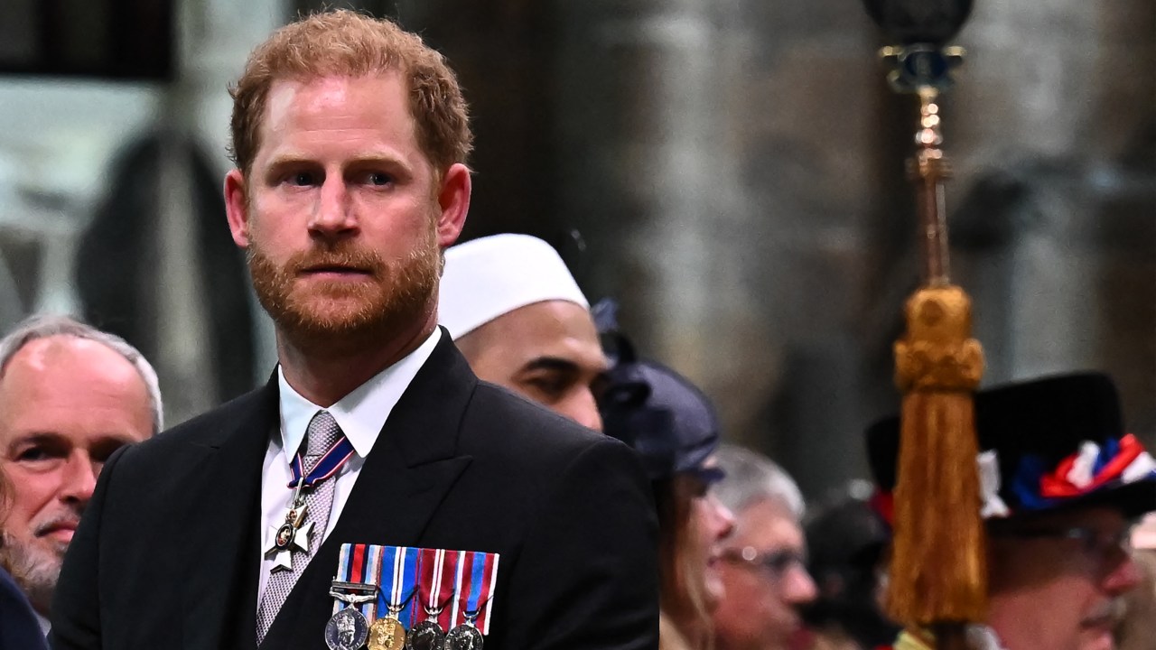 Britain's Prince Harry, Duke of Sussex looks on as Britain's King Charles III leaves Westminster Abbey after the Coronation Ceremonies in central London on May 6, 2023. The set-piece coronation is the first in Britain in 70 years, and only the second in history to be televised. Charles will be the 40th reigning monarch to be crowned at the central London church since King William I in 1066. Outside the UK, he is also king of 14 other Commonwealth countries, including Australia, Canada and New Zealand. (Photo by Ben Stansall / POOL / AFP)