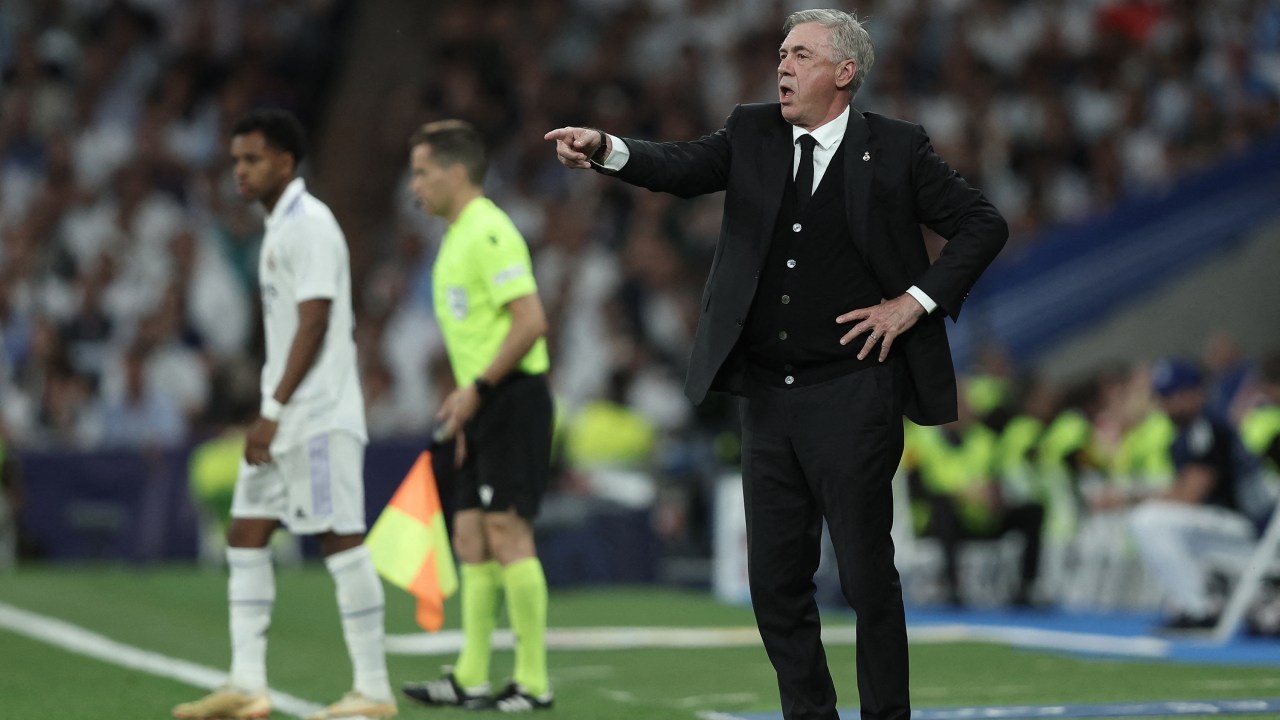 Carlo Ancelotti gestures from the touchline during the UEFA Champions League semi-final first leg football match between Real Madrid CF and Manchester City at the Santiago Bernabeu stadium in Madrid on May 9, 2023. (Photo by Thomas COEX / AFP)