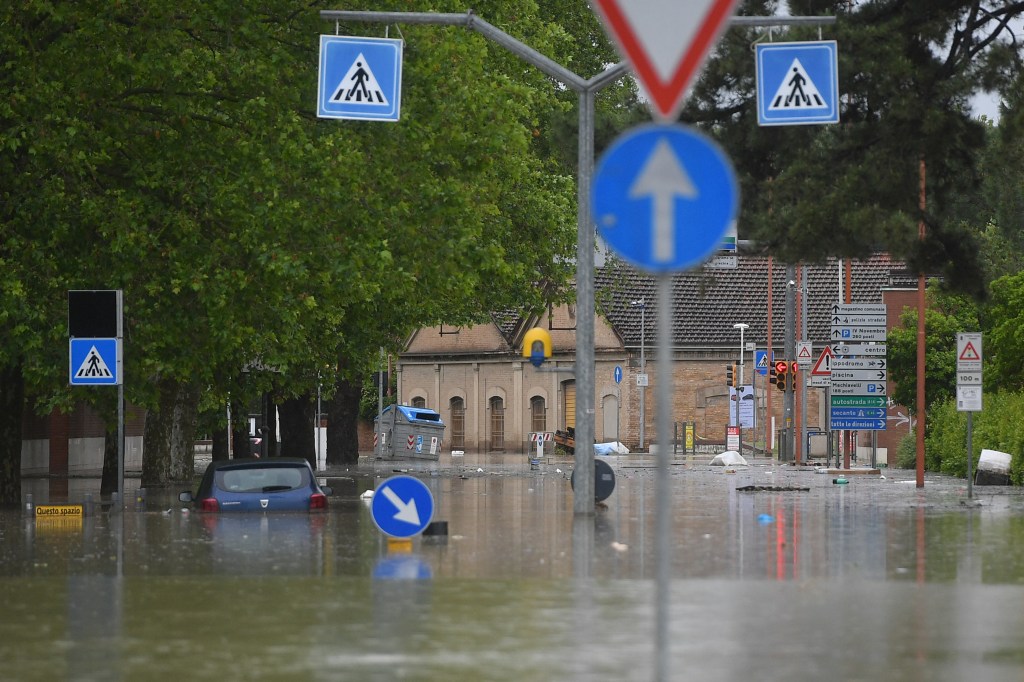 A flooded street is pictured in Cesena on May 17, 2023 after heavy rains caused major floodings in central Italy. Trains were stopped and schools were closed in many towns while people were asked to leave the ground floors of their homes and to avoid going out, and five people have died after the floodings across Italy's northern Emilia Romagna region. (Photo by Alessandro SERRANO / AFP)