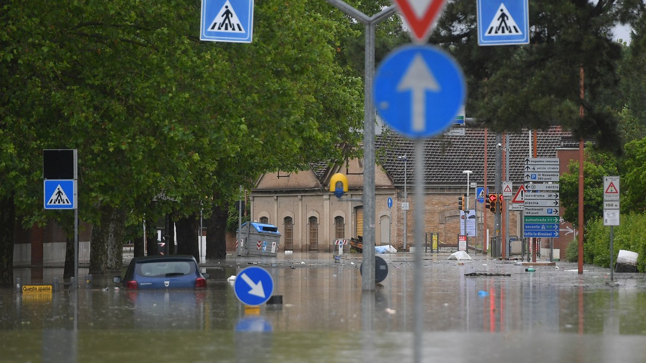 A flooded street is pictured in Cesena on May 17, 2023 after heavy rains caused major floodings in central Italy. Trains were stopped and schools were closed in many towns while people were asked to leave the ground floors of their homes and to avoid going out, and five people have died after the floodings across Italy's northern Emilia Romagna region. (Photo by Alessandro SERRANO / AFP)