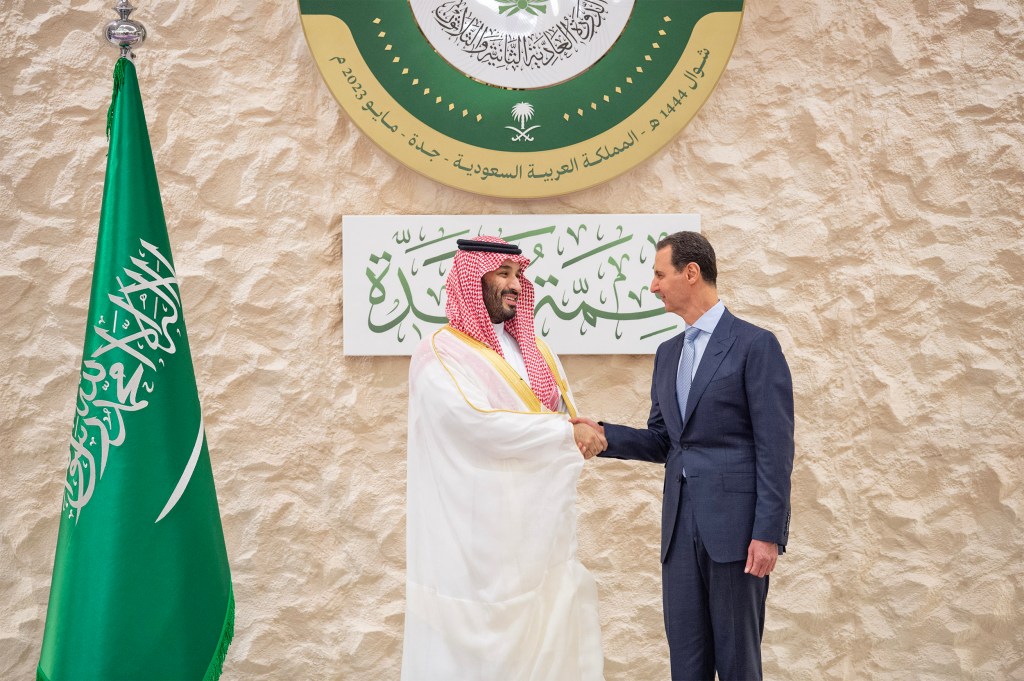 This handout picture provided by the Saudi Royal Palace on May 19, 2023 shows Saudi Crown Prince Mohammed bin Salman (L) shaking hands with Syria's President Bashar al-Assad on the sidelines of the Arab Summit meeting in Jeddah. Arab leaders welcomed Syrian President Bashar al-Assad back into the fold Friday at a summit in Saudi Arabia that is also expected to confront conflicts across the Middle East and beyond. (Photo by Bandar AL-JALOUD / Saudi Royal Palace / AFP) / RESTRICTED TO EDITORIAL USE - MANDATORY CREDIT "AFP PHOTO / SAUDI ROYAL PALACE" - NO MARKETING NO ADVERTISING CAMPAIGNS - DISTRIBUTED AS A SERVICE TO CLIENTS
