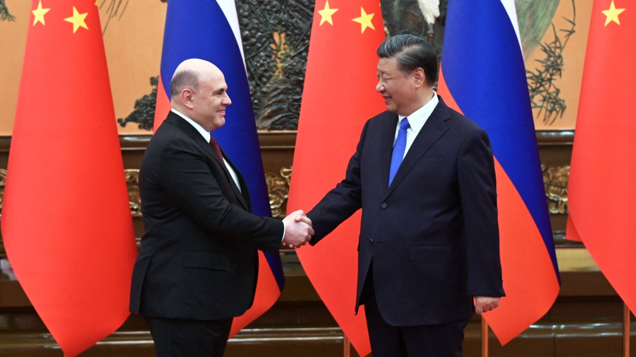 Russian Prime Minister Mikhail Mishustin meets with China's President Xi Jinping in Beijing on May 24, 2023. (Photo by Alexander ASTAFYEV / SPUTNIK / AFP)