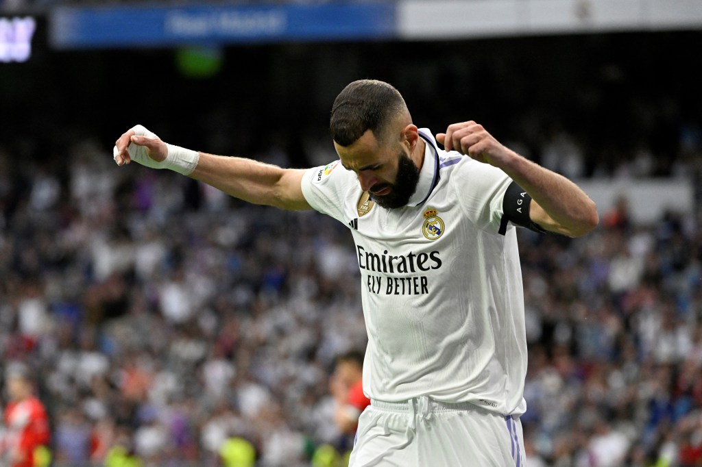 Real Madrid's French forward Karim Benzema celebrates scoring his team's first goal during the Spanish league football match between Real Madrid CF and Rayo Vallecano de Madrid at the Santiago Bernabeu stadium in Madrid on May 24, 2023. (Photo by JAVIER SORIANO / AFP)