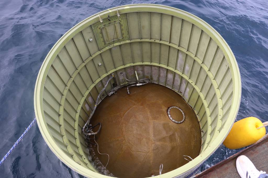 This handout photo taken on May 31, 2023 and provided by South Korean Defence Ministry in Seoul shows an object presumed to be part of North Korea's claimed 'Space Launch Vehicle' being salvaged by South Korea's miliaty in waters 200km (124 miles) west of Eocheong Island in the Yellow Sea. South Korea's military said on May 31, it had located and was salvaging a suspected part of a North Korean spy satellite that crashed into the sea shortly after launch due to a rocket failure. (Photo by Handout / South Korean Defence Ministry / AFP) / RESTRICTED TO EDITORIAL USE - MANDATORY CREDIT