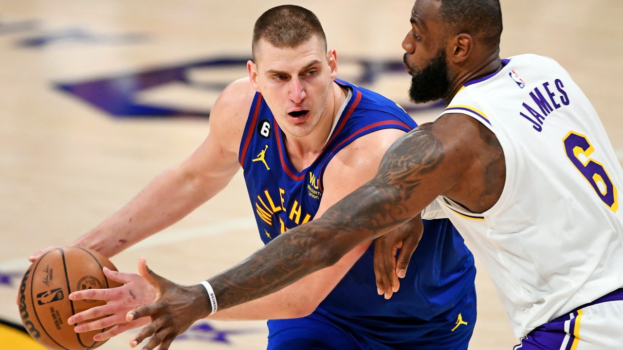 LOS ANGELES, CALIFORNIA - MAY 20: Nikola Jokic #15 of the Denver Nuggets handles the ball against LeBron James #6 of the Los Angeles Lakers during the fourth quarter in game three of the Western Conference Finals at Crypto.com Arena on May 20, 2023 in Los Angeles, California. NOTE TO USER: User expressly acknowledges and agrees that, by downloading and or using this photograph, User is consenting to the terms and conditions of the Getty Images License Agreement. Kevork Djansezian/Getty Images/AFP (Photo by KEVORK DJANSEZIAN / GETTY IMAGES NORTH AMERICA / Getty Images via AFP)
