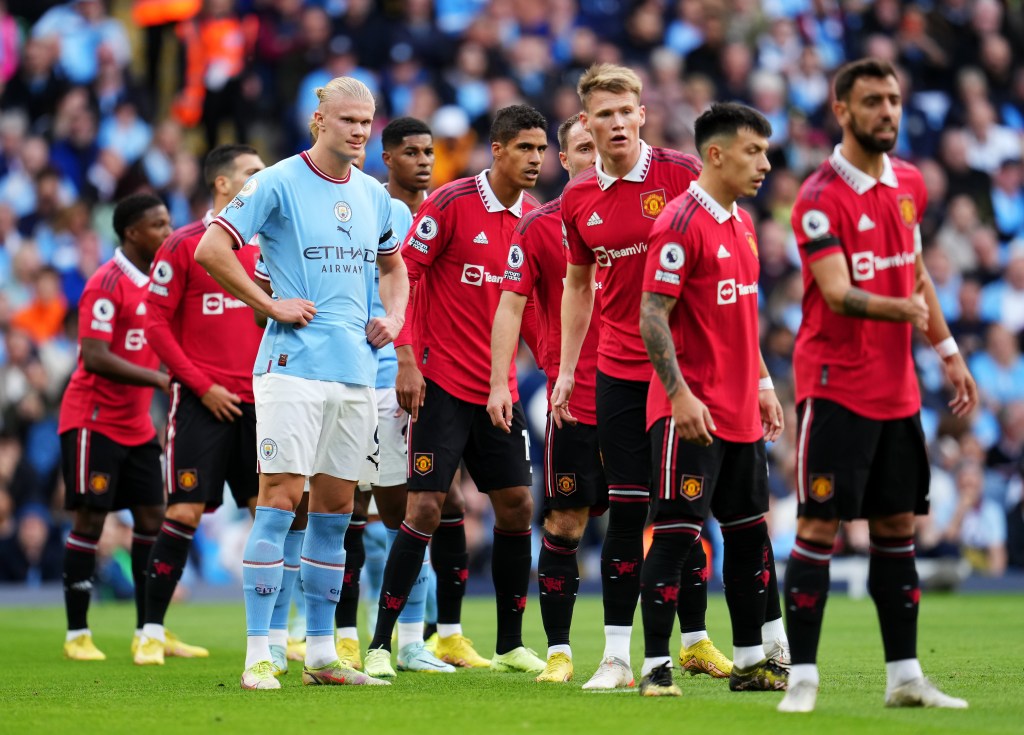 MANCHESTER, ENGLAND - OCTOBER 02: Erling Haaland of Manchester City is marked by Manchester United players during the Premier League match between Manchester City and Manchester United at Etihad Stadium on October 02, 2022 in Manchester, England. (Photo by Matt McNulty - Manchester City/Manchester City FC via Getty Images)