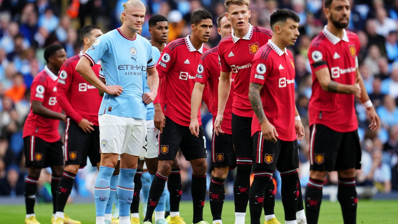 MANCHESTER, ENGLAND - OCTOBER 02: Erling Haaland of Manchester City is marked by Manchester United players during the Premier League match between Manchester City and Manchester United at Etihad Stadium on October 02, 2022 in Manchester, England. (Photo by Matt McNulty - Manchester City/Manchester City FC via Getty Images)