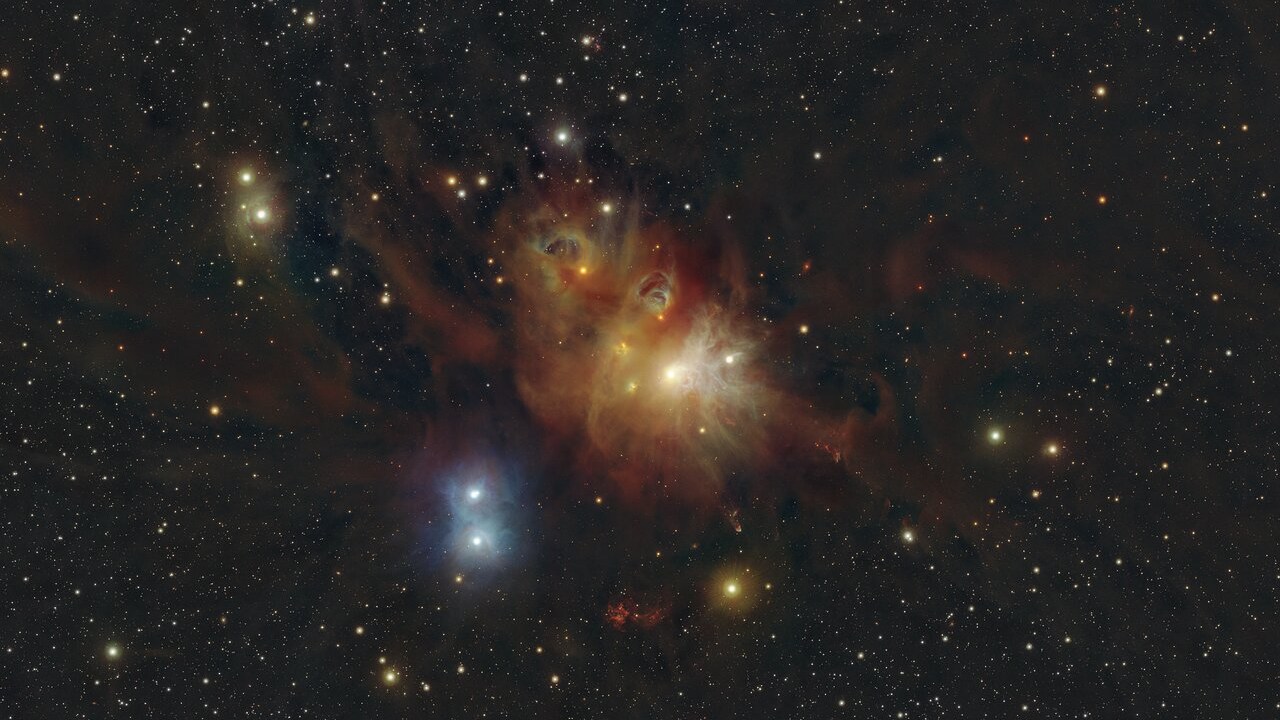 This image shows the regions around the Coronet star cluster in the Corona Australis constellation. New stars are born in the colourful clouds of gas and dust seen here. The infrared observations underlying the image reveal new details in the star-forming regions that are usually obscured by the clouds of dust. The image was produced with data collected by the VIRCAM instrument, which is attached to the VISTA telescope at ESO’s Paranal Observatory in Chile. The observations were done as part of the VISIONS survey, which will allow astronomers to better understand how stars form in these dust-enshrouded regions.
